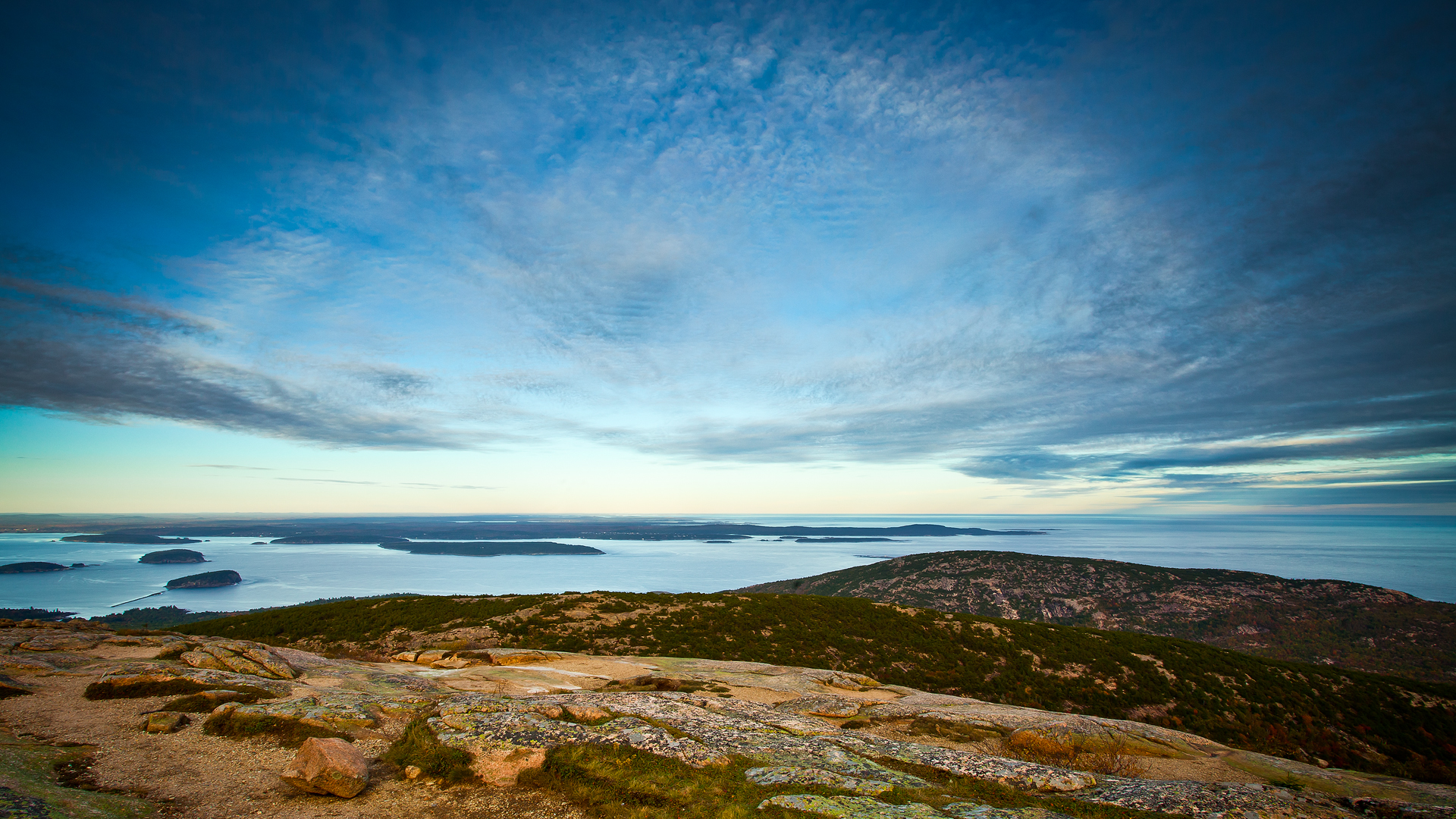Azure Skies Over Rocky Terrain and Islands