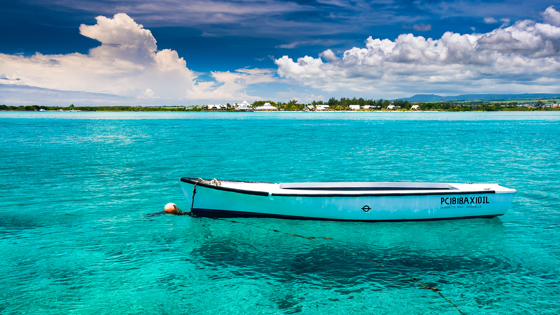Tranquil Turquoise: A Boat's Serene Repose